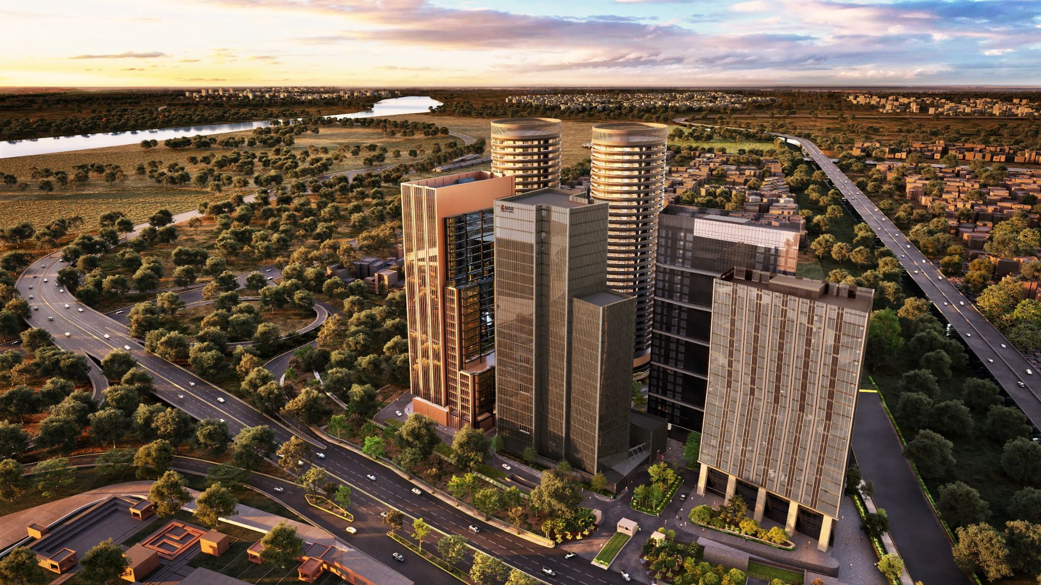 Aerial view of Max One residential high-rise towers with landscaped roads and urban surroundings