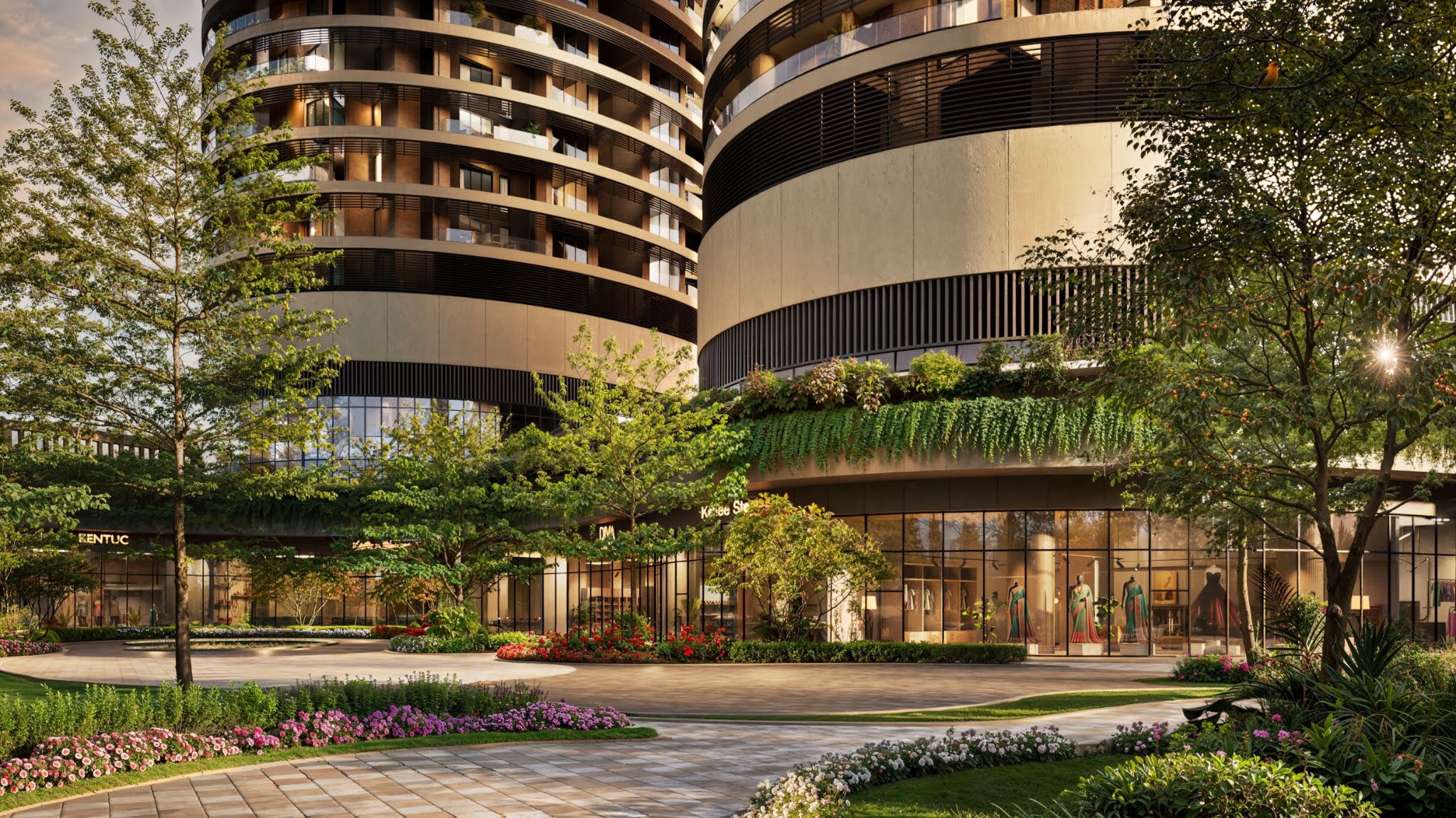 Max One residential towers with modern curved architecture, landscaped gardens, and luxury entrance area