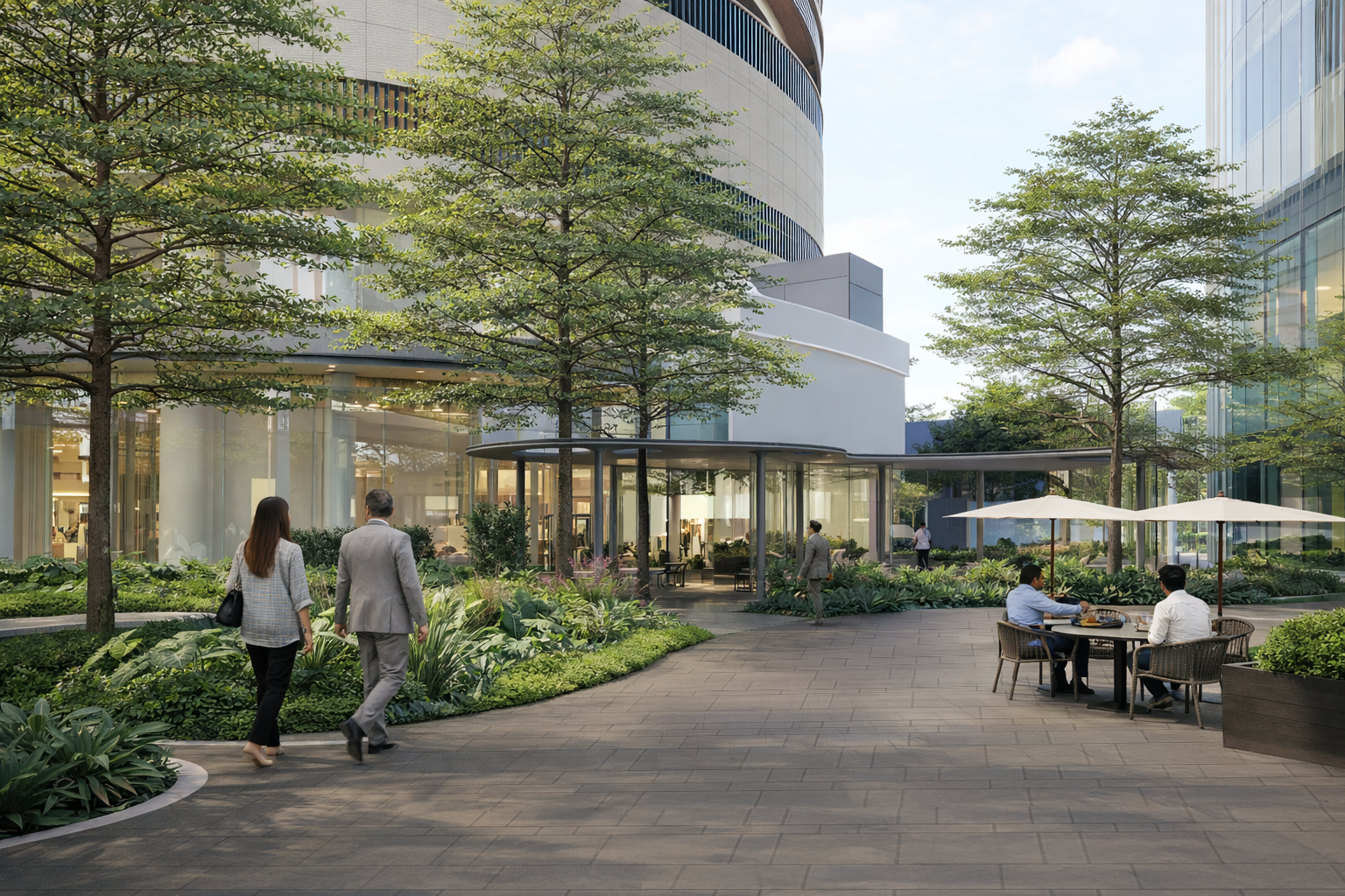 Contemporary business park with greenery, walking paths, and outdoor dining space