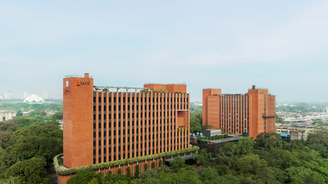 Max House commercial buildings with brick facades and surrounding greenery